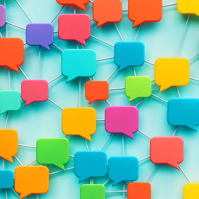 Connected communication speech bubbles in a rainbow of bright colors to represent client communication