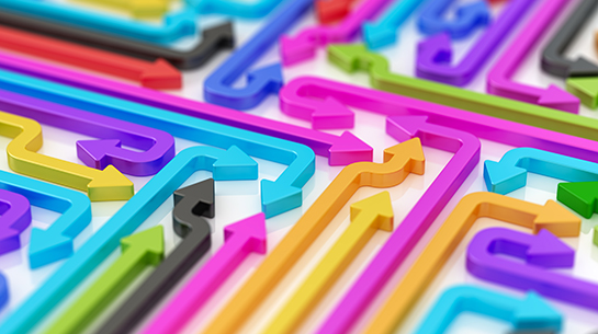 Arrows in all different colors, pointing in different directions and changing direction to represent redefining a brand during a rebrand