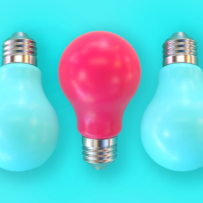 A solid, bright pink light bulb in the center of teal light bulbs that blend with the teal background to represent the attention a brand earns from its brand marketing